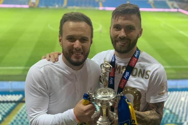 Marcus celebrates with Stuart after Leeds United won the Championship title