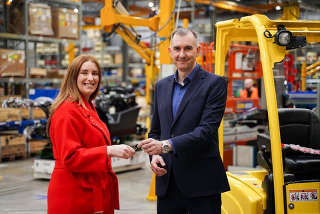 Hyster has donated its 500,000th forklift to Mallusk-based FareShare, part of the UK’s longest running food redistribution charity. Pictures is Darren Johnston, Hyster Craigavon Plant manager presenting the keys of the 500,000th forklift to Roisin Colohan, operations manager, FareShare