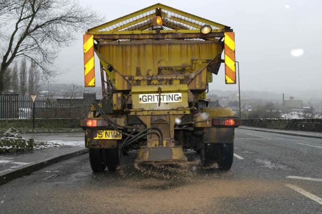 A gritter spreads salt on the roads