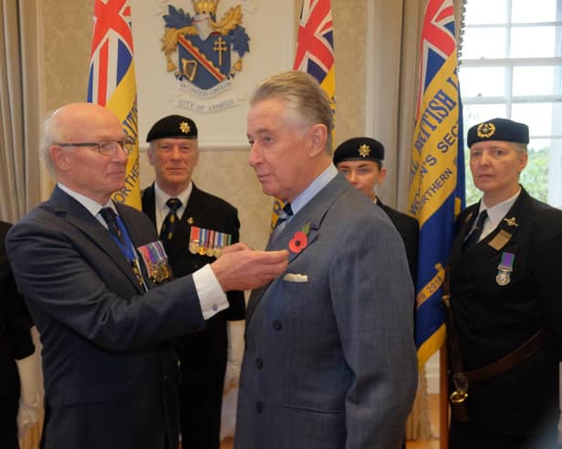 President of the Royal British Legion in Northern Ireland, Col Neil Salisbury (ret’d), pinning a poppy on Lord Lieutenant Lord Nicholas Caledon