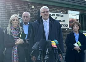 DUP leader Gavin Robinson MP (centre right) speaks to media at Police Service of Northern Ireland headquarters in east Belfast after meeting Chief Constable Jon Boutcher on Wednesday