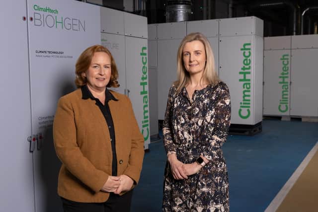 Belfast-based net zero innovation company Catagen has received £1m of funding from the Growth Finance Fund which will be used to accelerate the growth of the business. Pictured are Susan Crawford from Catagen and Rhona Barbour from Whiterock Finance with one of the ClimaHtech generators at their headquarters in Titanic Quarter