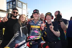 Davey Todd celebrates his victory in the opening Supersport race at the North West 200