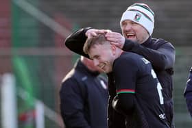 Glentoran's Charlie Lindsay is greeted by his manager Warren Feeney after being subbed during Saturday's game at The Oval, Belfast. PIC: David Maginnis/Pacemaker Press