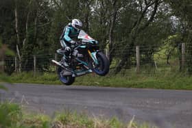 Michael Dunlop set the fastest ever qualifying lap at Armoy to claim Superbike pole on Friday