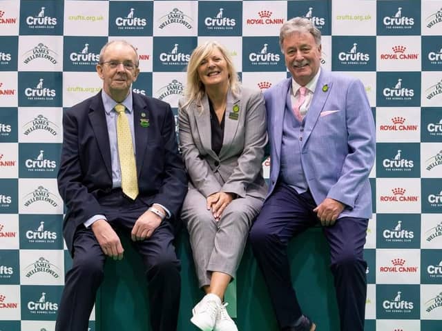 Kate McCartney from Lisburn has become the first-ever female UK Crufts chief obedience steward. Pictured are outgoing chief steward Richard Kebble and new chief obedience steward Kate with her husband Michael who is the new assistant