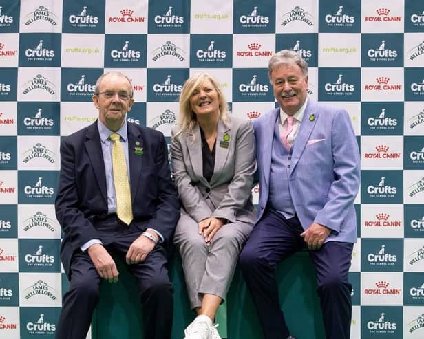 Kate McCartney from Lisburn has become the first-ever female UK Crufts chief obedience steward. Pictured are outgoing chief steward Richard Kebble and new chief obedience steward Kate with her husband Michael who is the new assistant