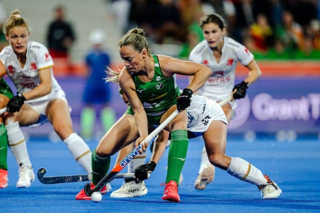 Mia Jennings of Ireland battles for the ball against Belgium