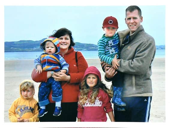 Co Antrim woman Joanne Shiels with her husband and four children