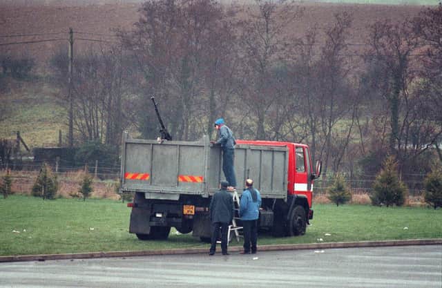 RUC officers at the scene of the SAS shooting of four IRA men near Coalisland..