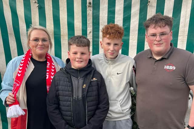 Margaret Ferguson and her sons Caleb, Lucas and Cian just before their team Larne FC lifted the Irish League cup for the first time on Friday night.