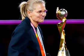 England head coach Sarina Wiegman walks past the trophy after being presented with her runner-up medal at the end of the FIFA Women's World Cup final. (Photo by Zac Goodwin/PA Wire)