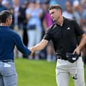 Northern Ireland's Rory McIlroy and Ludvig Aberg of Sweden shake hands on the 18th green during day one of the BMW PGA Championship at Wentworth