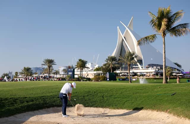 Northern Ireland's Rory McIlroy plays his second shot on the 18th hole across day two of the Dubai Invitational at Dubai Creek Golf and Yacht Club. (Photo by Warren Little/Getty Images)