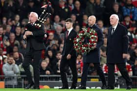 A piper at Old Trafford during the pre-match tribute to Sir Bobby Charlton as Manchester United boss Erik ten Hag, Charlton's former team-mate Alex Stepney and current youth captain Dan Gore walk out to lay a wreath at the halfway line before a minute’s silence in the Champions League fixture against FC Copenhagen. (Photo by Jan Kruger/Getty Images)