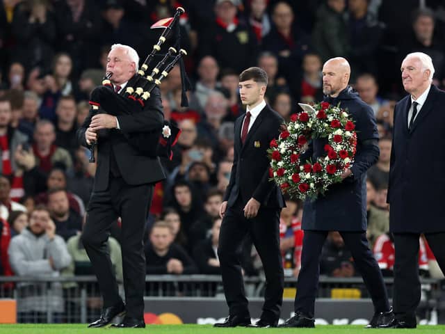 A piper at Old Trafford during the pre-match tribute to Sir Bobby Charlton as Manchester United boss Erik ten Hag, Charlton's former team-mate Alex Stepney and current youth captain Dan Gore walk out to lay a wreath at the halfway line before a minute’s silence in the Champions League fixture against FC Copenhagen. (Photo by Jan Kruger/Getty Images)