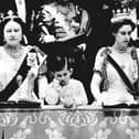 File photo dated 02/06/53 of Prince Charles looking solemn as he stands chin on hand between the Queen Mother and Princess Margaret in the Royal Box at Westminster Abbey, from where he saw Queen Elizabeth II crowned. Issue date: Wednesday April 26, 2023.