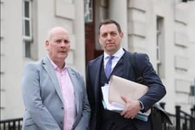 Patrick Thompson (left) pictured outside the High Court in Belfast where his conviction for the murder of four British soldiers in the 1970s was overturned.  Mr Thompson is pictured with his solicitor Pádraig Ó Muirigh.