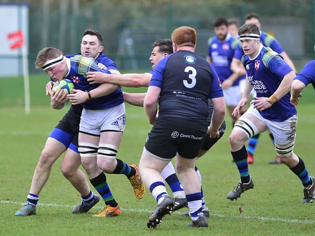 Curtis Pollock in possession for Queen's during 2023. (Photo by Arthur Allison/Pacemaker Press)