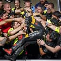 Marco Bezzecchi celebrates with the Mooney VR46 Ducati team after winning the French GP