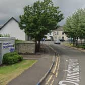 The PSNI said the victim was found the public car park in the Dundarave area of the town, where, two vans including one belonging to the injured man were on fire.Photo: Googlemaps