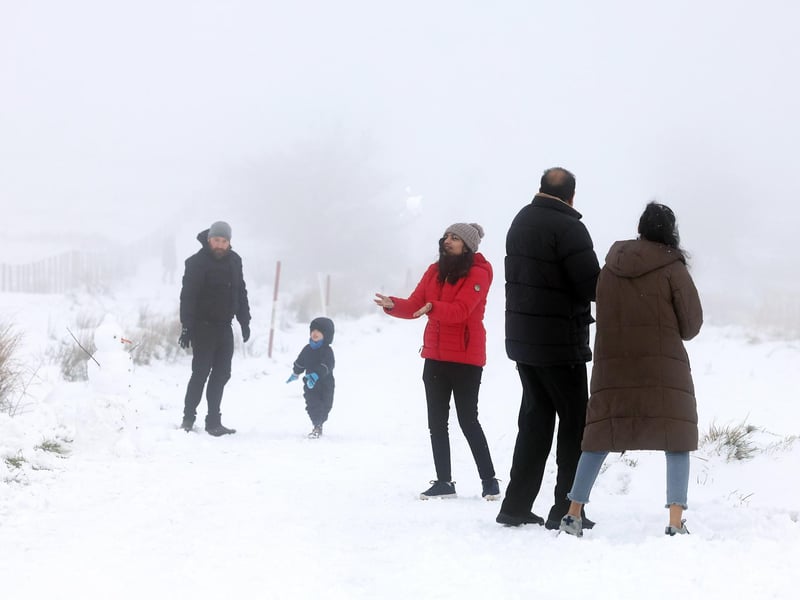 Snow fall on Divis and Black Mountain, West Belfast.Members of the public pictured on Divis Mountain on the outskirts of west Belfast.Picture by Jonathan Porter/PressEye