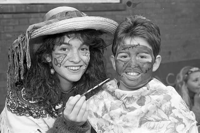 Pictured at the end of September 1992 at the Dromore Horse Fair is Ballymena Academy art teacher Racquelle Reid who is seen trying out her face-painting skills on Jannine Moore. Picture: News Letter archives/Darryl Armitage