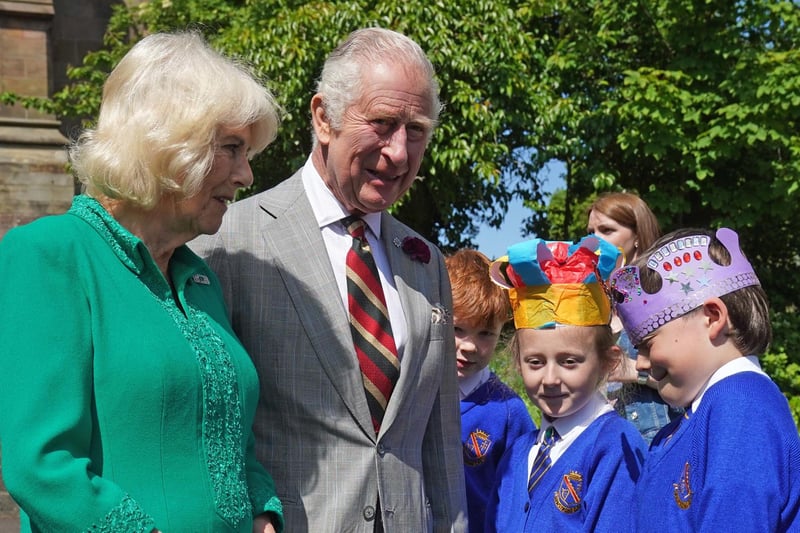 King Charles III and Queen Camilla meet Camilla Nowawakowska aged 8 and Charles Murray aged 8 from Armstrong primary school Armagh outside St Patrick's Cathedral in Armagh, Co Armagh, during a two day visit to Northern Ireland.