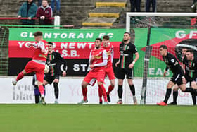 Cliftonville’s Ryan Curran scores against Glentoran at The Oval on Sunday.