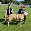 Martin McConville with the inter breed sheep champion at Lurgan Show 2023. Adding his congratulations is Alistair Christie, who judged
the class. Pic sent in by Richard Halleron June 3 2023