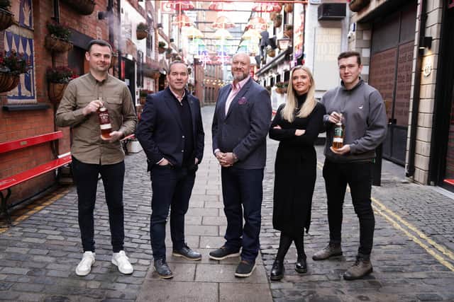 John Kelly, chief executive Belfast Distillery Company and Mark Johnston, new head of sales and marketing pictured with the McConnell's Whisky sales force