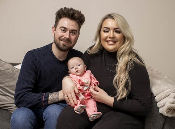 Marcus and Rachel Gilmore with their daughter Raina at their home outside Ballyclare. Raina believed to be the smallest surviving premature baby ever born on the island of Ireland has been described as her parents' "little miracle" ahead of a special first Christmas at home together. Raina weighed just 378g, less than one pound, when she was delivered via caesarean section at 26 weeks on June 28 this year and her parents were told she had about a 10% chance of survival