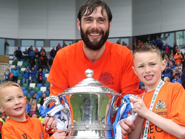 Glenavon repeated their Irish Cup success in 2015/16 as they defeated Linfield 2-0 thanks to goals from Kevin Braniff and Andy Hall. Here's Hamilton celebrating with his children and the trophy at Windsor Park