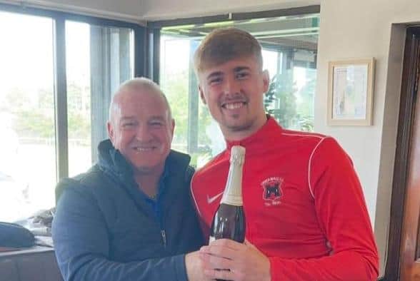 Thomas Burns receives his man of the match award after scoring five goals in a cup win against Crewe United. PIC: Lower Maze FC