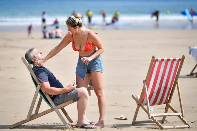 Sunbathers applying sunscreen during the hot sunshine. Cheap supermarket own-brand sunscreen has triumphed in safety testing – while one lotion from Avon has been labelled a "Don’t Buy", according to consumer group Which? Two rounds of testing by the watchdog found Avon's Refreshing 3-in-1 Face and Body Sun Lotion SPF30, costing £5.75 for 150ml, "did not come close to hitting its claimed SPF30". Which? advised consumers to avoid the product, saying it did not offer adequate sun protection.