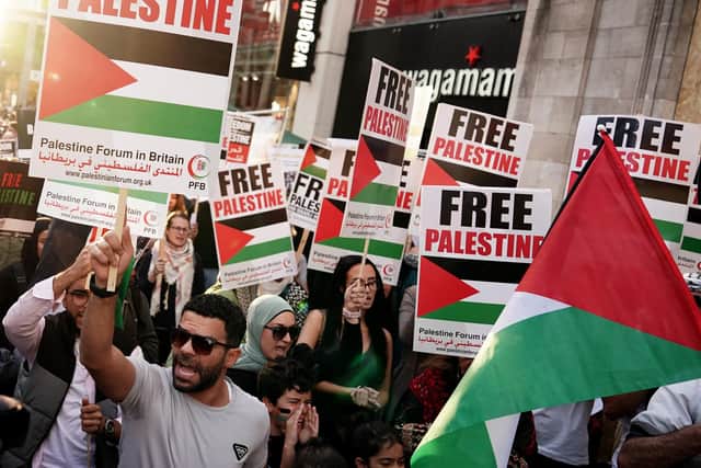 People take part in a Palestine Solidarity Campaign demonstration near the Israeli Embassy, in Kensingston, London, as the death toll rises amid ongoing violence in Israel and Gaza following the attack by Hamas. Picture date: Monday October 9, 2023. PA Photo. Photo credit should read: Jordan Pettitt/PA Wire
