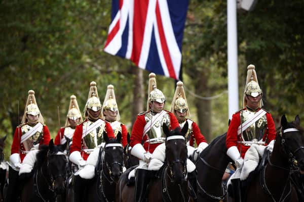 Royal Horse Guards on parade ahead of the ceremonial procession of the coffin of Queen Elizabeth II from Buckingham Palace to Westminster Hall, London. Picture date: Wednesday September 14, 2022.  Photo credit: Henry Nicholls/PA Wire