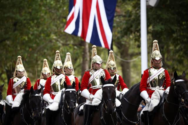 Royal Horse Guards on parade ahead of the ceremonial procession of the coffin of Queen Elizabeth II from Buckingham Palace to Westminster Hall, London. Picture date: Wednesday September 14, 2022.  Photo credit: Henry Nicholls/PA Wire
