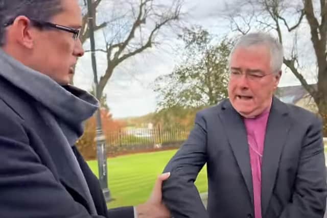 Enoch Burke pictured grabbing the archbishop during the encounter