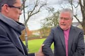 Enoch Burke pictured grabbing the archbishop during the encounter