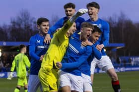 Mason Munn is mobbed by his Rangers teammates after he was their penalty shoot-out hero. PIC: Rangers FC