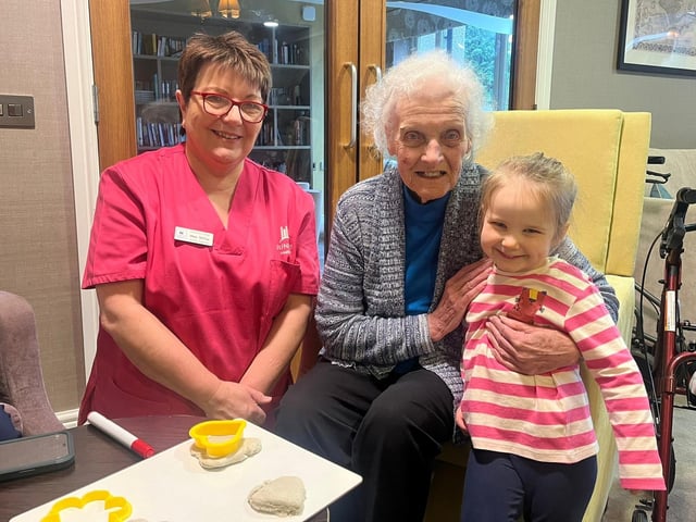 Residents and staff from Oakmont Lodge Care Home learns some creative skills from a Red Brick House Nursery School pupil as part of a one-of-its-kind pilot scheme that will bring together children aged three to four with older people