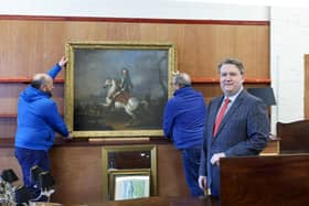The King William III painting attracted significant interest with it being sold to an interested party in London. Pictured is Karl Bennett and staff with the King William III portrait
