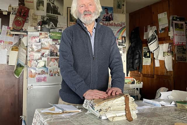 Previously unissued photo dated 28/01/23 of Irish traditional match maker Willie Daly in the kitchen of his home on a donkey farm close to Lisdoonvarna, Co Clare. Mr Daly, who has been bringing couples together since he was a teenager, has a leather-bound match making book, stuffed full with letters of people seeking a partner.