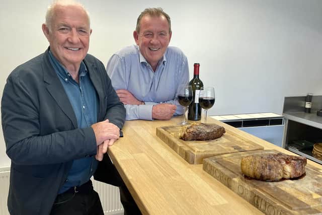Enjoying one of the classic Hannan Delmonico steaks is distinguished chef Rick Stein, left, with Peter Hannan, the founder and manager of Hannan Meats in Moira