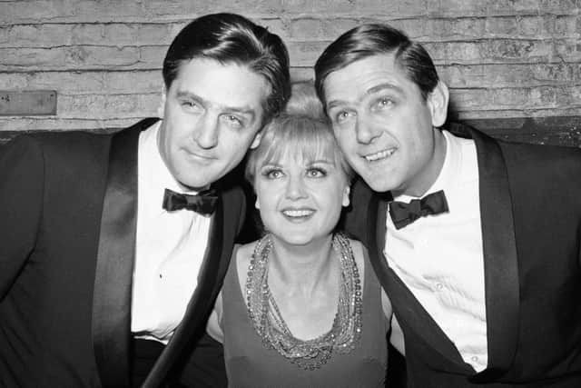 Angela Lansbury with her twin brothers Edgar, left, and Bruce backstage at the Belasco Theatre in New York in February 1966. AP Photo/Charles Harrity, File)