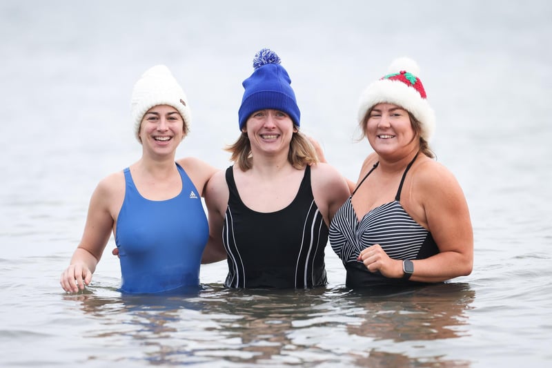 Laura Payne, Kerry Coulter and Tina Woods join swimmers from north Down take part in the annual Santa Splash at Helens Bay beach, County Down.