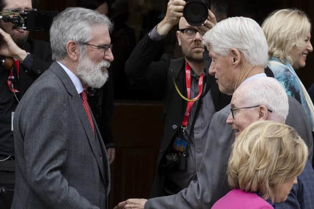 Former Sin Fein President Gerry Adams (left) speaks with former US President Bill Clinton (right) during the three-day international conference at Queen's University Belfast to mark the 25th anniversary of the Belfast/Good Friday Agreement.