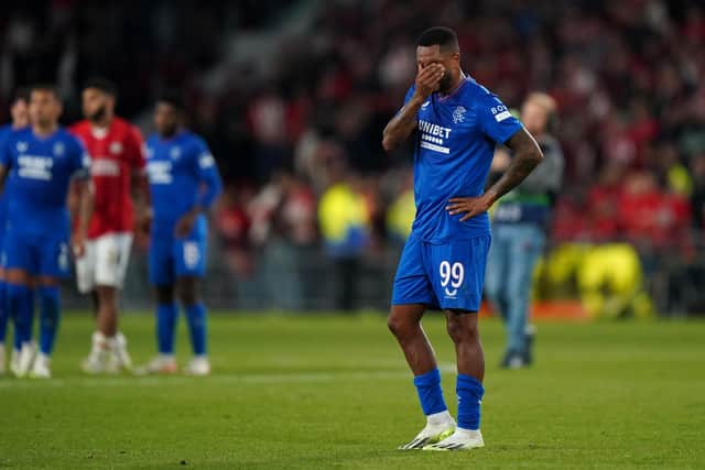 Rangers' Danilo appears dejected after the Ibrox side were thrashed 5-1 by PSV Eindhoven last night, losing 7-3 on aggregate as their Champions League hopes were ended in the second leg play-off match. MATCH REPORT: PAGE 39