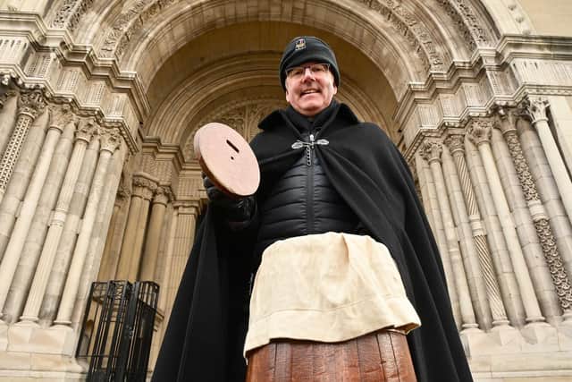 Dean Stephen Forde pictured on his annual sit-out at St Anne's Cathedral ahead of Christmas; he has now revealed the total raised